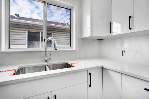 6032 Martingrove Road, Calgary, AB - Indoor Photo Showing Kitchen With Double Sink