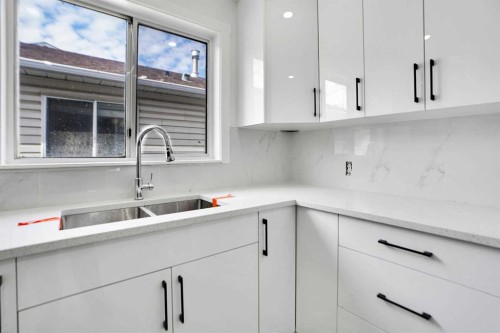 6032 Martingrove Road, Calgary, AB - Indoor Photo Showing Kitchen With Double Sink