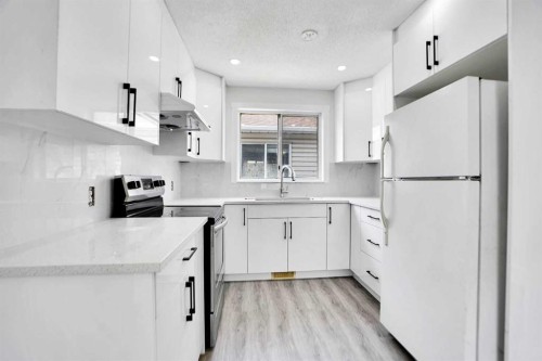 6032 Martingrove Road, Calgary, AB - Indoor Photo Showing Kitchen With Upgraded Kitchen