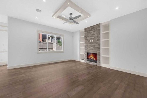 127 Evansview Road Nw, Calgary, AB - Indoor Photo Showing Other Room With Fireplace