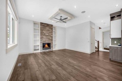 127 Evansview Road Nw, Calgary, AB - Indoor Photo Showing Living Room With Fireplace