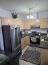 2204-333 Taravista Drive Ne, Calgary, AB  - Indoor Photo Showing Kitchen With Double Sink 