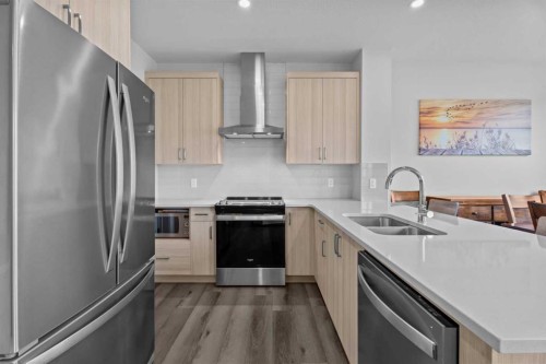 122 South Shore Court, Chestermere, AB - Indoor Photo Showing Kitchen With Double Sink With Upgraded Kitchen