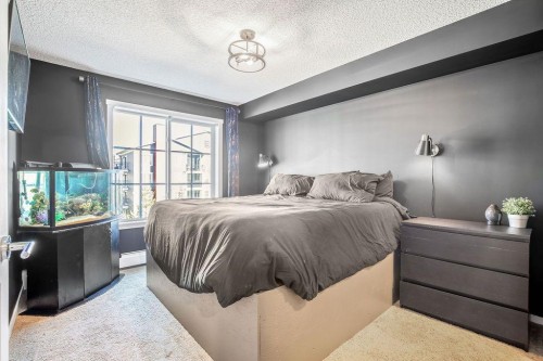 1311-755 Copperpond Boulevard Se, Calgary, AB - Indoor Photo Showing Bedroom