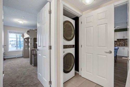 1311-755 Copperpond Boulevard Se, Calgary, AB - Indoor Photo Showing Laundry Room