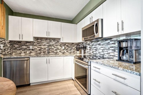 1311-755 Copperpond Boulevard Se, Calgary, AB - Indoor Photo Showing Kitchen With Upgraded Kitchen