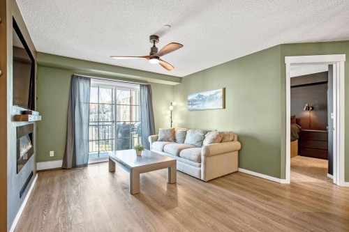 1311-755 Copperpond Boulevard Se, Calgary, AB - Indoor Photo Showing Living Room