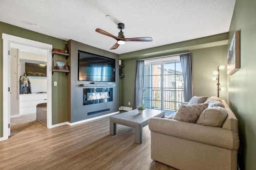 1311-755 Copperpond Boulevard Se, Calgary, AB - Indoor Photo Showing Living Room