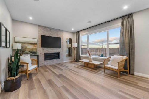 207 Brander Avenue, Langdon, AB - Indoor Photo Showing Living Room With Fireplace