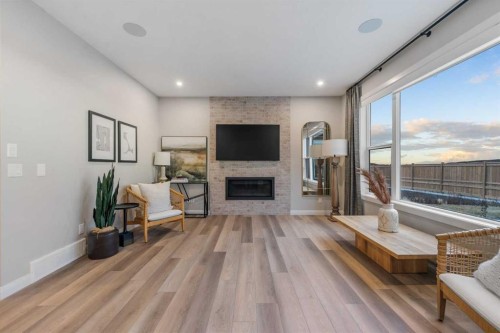 207 Brander Avenue, Langdon, AB - Indoor Photo Showing Living Room With Fireplace