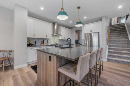 207 Brander Avenue, Langdon, AB - Indoor Photo Showing Kitchen With Stainless Steel Kitchen With Upgraded Kitchen