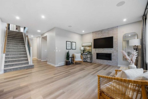 207 Brander Avenue, Langdon, AB - Indoor Photo Showing Living Room With Fireplace