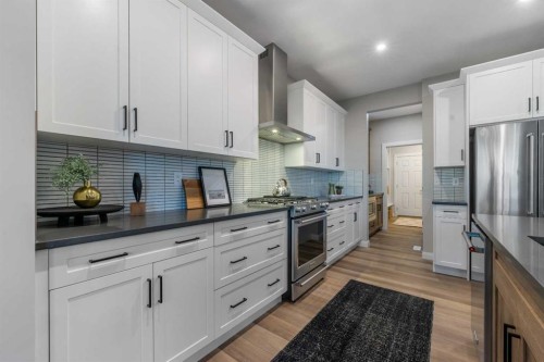 207 Brander Avenue, Langdon, AB - Indoor Photo Showing Kitchen With Stainless Steel Kitchen With Upgraded Kitchen