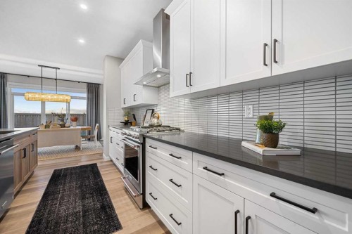 207 Brander Avenue, Langdon, AB - Indoor Photo Showing Kitchen With Upgraded Kitchen