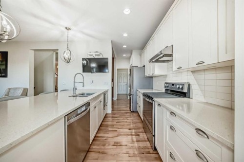 115 Mahogany Way Se, Calgary, AB - Indoor Photo Showing Kitchen With Stainless Steel Kitchen With Double Sink With Upgraded Kitchen
