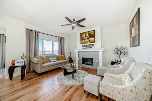 115 Mahogany Way Se, Calgary, AB - Indoor Photo Showing Living Room With Fireplace
