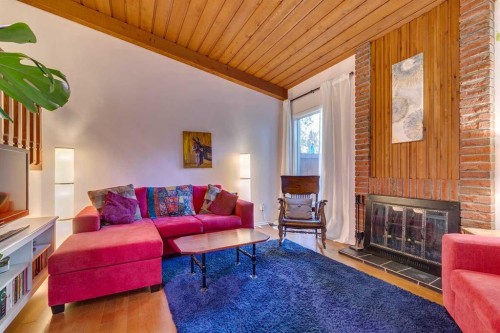 11-10030 Oakmoor Way Sw, Calgary, AB - Indoor Photo Showing Living Room With Fireplace