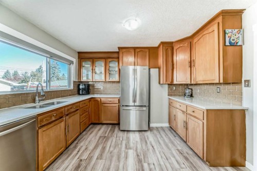 5414 Valentine Crescent Se, Calgary, AB - Indoor Photo Showing Kitchen With Double Sink