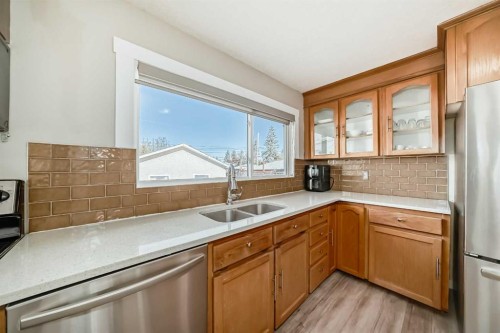 5414 Valentine Crescent Se, Calgary, AB - Indoor Photo Showing Kitchen With Double Sink