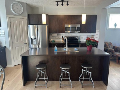 64 Elgin Meadows Manor Se, Calgary, AB - Indoor Photo Showing Kitchen With Double Sink With Upgraded Kitchen