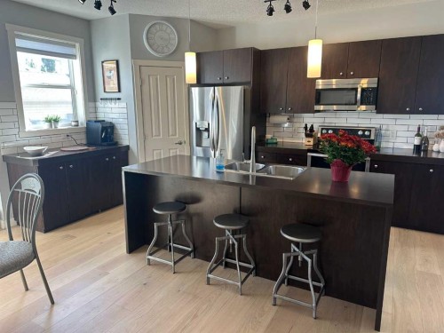 64 Elgin Meadows Manor Se, Calgary, AB - Indoor Photo Showing Kitchen With Double Sink With Upgraded Kitchen