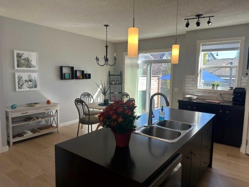 64 Elgin Meadows Manor Se, Calgary, AB - Indoor Photo Showing Kitchen With Double Sink