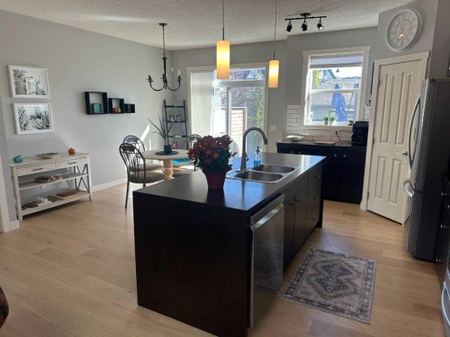 64 Elgin Meadows Manor Se, Calgary, AB - Indoor Photo Showing Kitchen With Double Sink