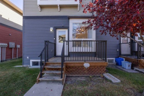 201-2066 Luxstone Boulevard Sw, Airdrie, AB - Outdoor With Deck Patio Veranda With Exterior