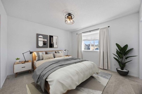 201-2066 Luxstone Boulevard Sw, Airdrie, AB - Indoor Photo Showing Bedroom