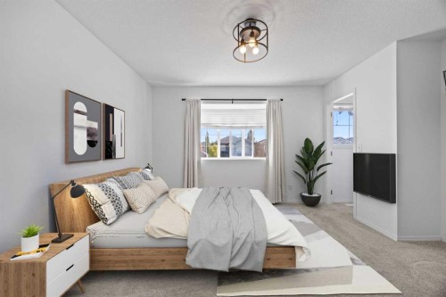 201-2066 Luxstone Boulevard Sw, Airdrie, AB - Indoor Photo Showing Bedroom