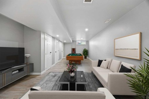 201-2066 Luxstone Boulevard Sw, Airdrie, AB - Indoor Photo Showing Living Room