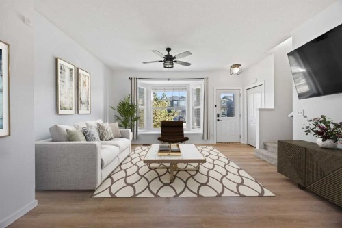201-2066 Luxstone Boulevard Sw, Airdrie, AB - Indoor Photo Showing Living Room