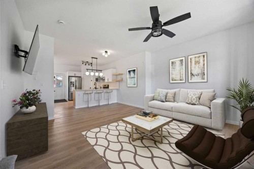 201-2066 Luxstone Boulevard Sw, Airdrie, AB - Indoor Photo Showing Living Room