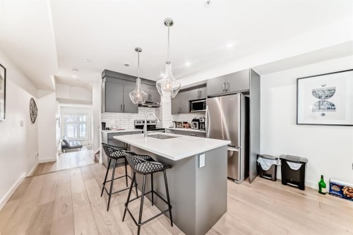 108-1632 20 Avenue Nw, Calgary, AB - Indoor Photo Showing Kitchen With Stainless Steel Kitchen With Upgraded Kitchen