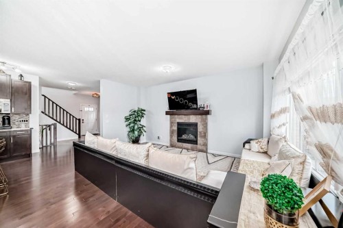 165 Hillcrest Drive Sw, Airdrie, AB - Indoor Photo Showing Living Room With Fireplace