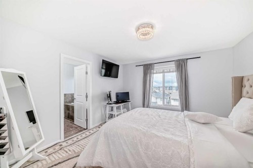 165 Hillcrest Drive Sw, Airdrie, AB - Indoor Photo Showing Bedroom