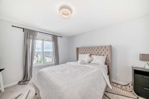 165 Hillcrest Drive Sw, Airdrie, AB - Indoor Photo Showing Bedroom