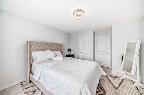 165 Hillcrest Drive Sw, Airdrie, AB - Indoor Photo Showing Bedroom