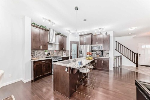 165 Hillcrest Drive Sw, Airdrie, AB - Indoor Photo Showing Kitchen With Upgraded Kitchen
