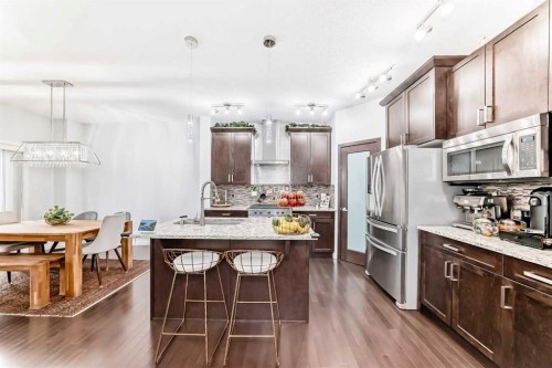 165 Hillcrest Drive Sw, Airdrie, AB - Indoor Photo Showing Kitchen With Upgraded Kitchen