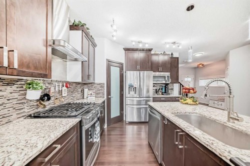 165 Hillcrest Drive Sw, Airdrie, AB - Indoor Photo Showing Kitchen With Upgraded Kitchen