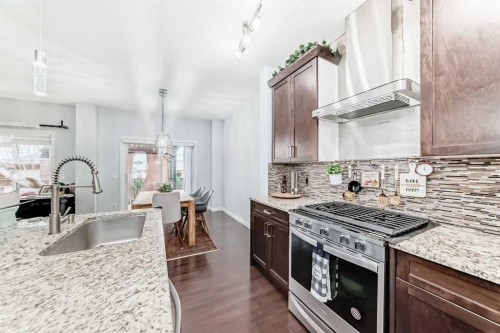 165 Hillcrest Drive Sw, Airdrie, AB - Indoor Photo Showing Kitchen With Upgraded Kitchen