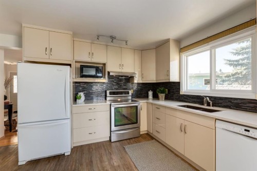 90 Allandale Close Se, Calgary, AB - Indoor Photo Showing Kitchen With Double Sink
