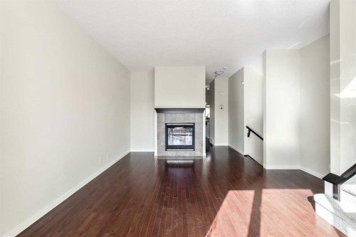 160 Sunset Point, Cochrane, AB - Indoor With Fireplace