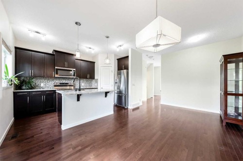 160 Sunset Point, Cochrane, AB - Indoor Photo Showing Kitchen With Upgraded Kitchen
