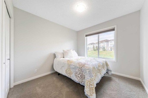 160 Sunset Point, Cochrane, AB - Indoor Photo Showing Bedroom