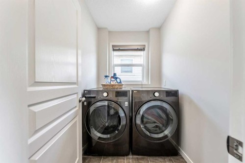 160 Sunset Point, Cochrane, AB - Indoor Photo Showing Laundry Room