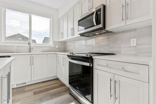 113 Calhoun Common Ne, Calgary, AB - Indoor Photo Showing Kitchen With Upgraded Kitchen