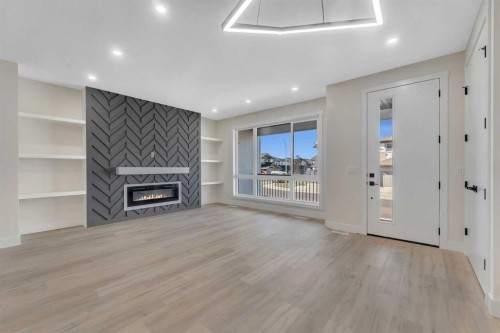 144 Saddlelake Manor Ne, Calgary, AB - Indoor With Fireplace