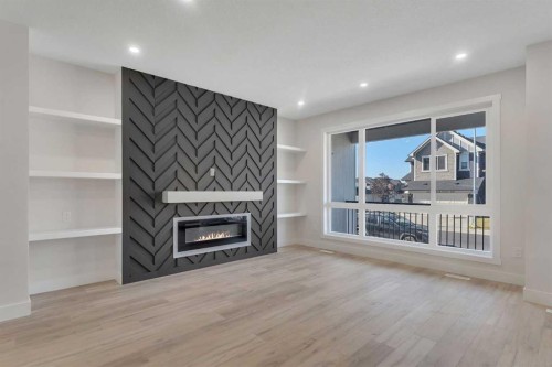 144 Saddlelake Manor Ne, Calgary, AB - Indoor Photo Showing Living Room With Fireplace